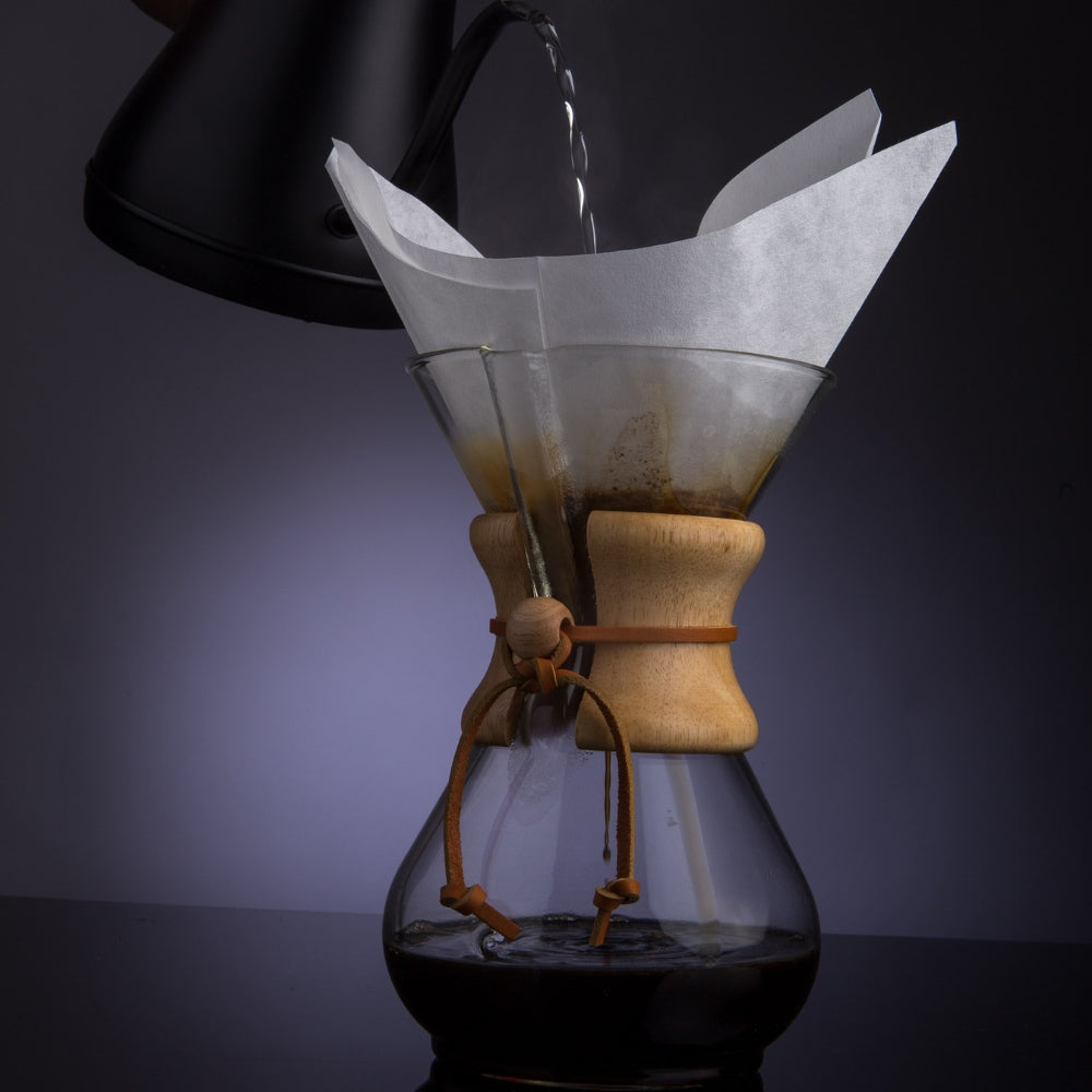 a image of boiled water getting poured in a coffee drainer